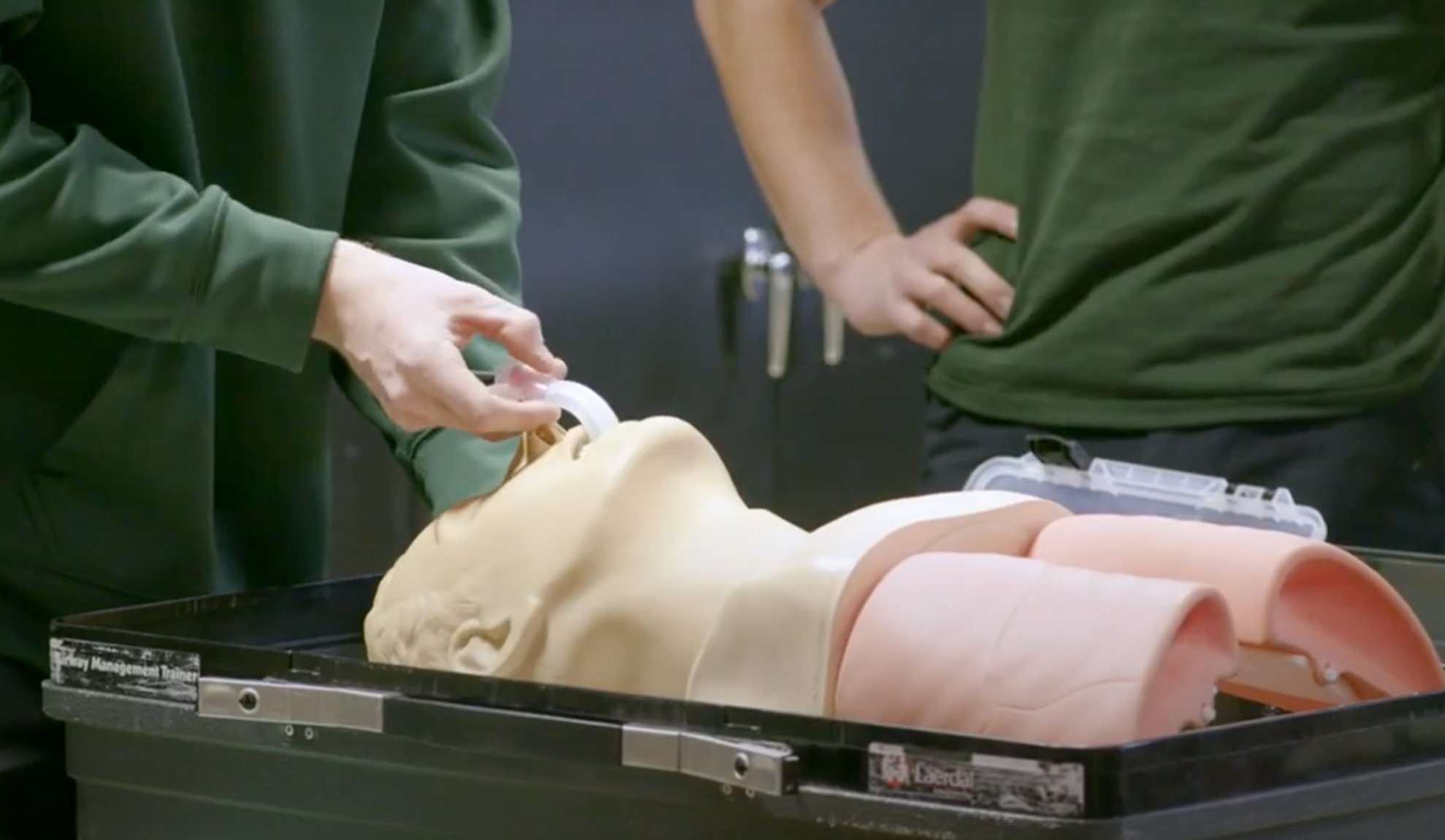 EMT practicing on a dummy