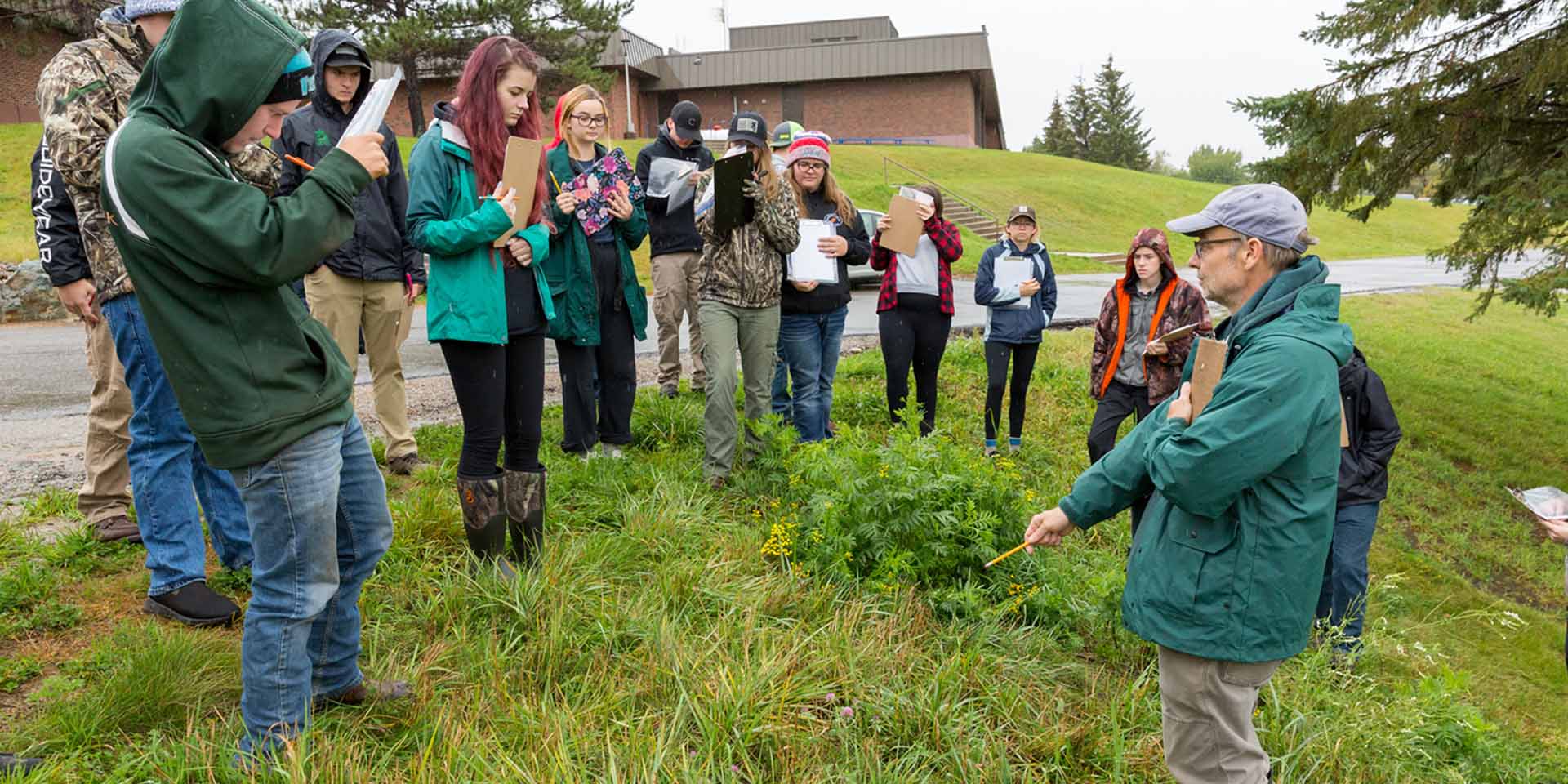 Instructor leading a class outdoors